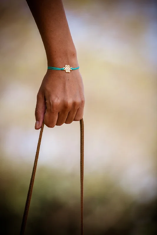 Colorful Beaded Stretch Bracelet-Turquoise cord bracelet with gold endless knot charm